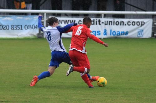 Enfields Sam Chaney (L) challenges Reece Hall