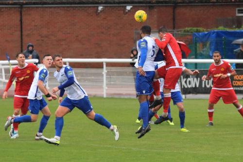 Enfields Taofiq Olomowewe (5) challenges Simon Cooper