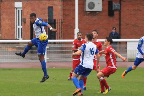 Enfields Taofiq Olomowewe (L) heads the ball to Josh Davison
