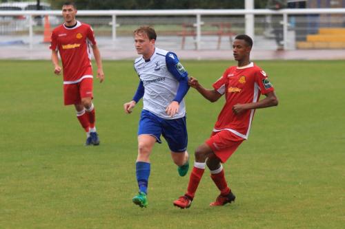 Mersthams Gus Sow (R) and Enfields Aaron Greene