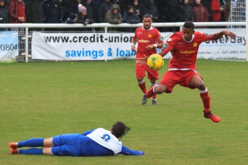 Mersthams Gus Sow (R) and Michael Abnett and Enfields Sam Chaney