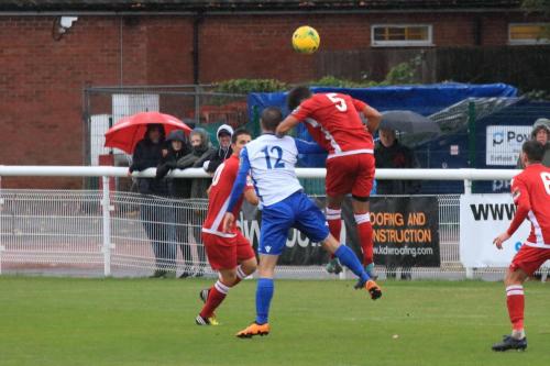 Mersthams Harry Osborne (5) challenges Liam Hope