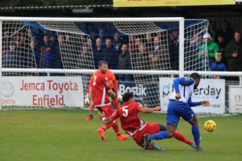 Mersthams Harry Osborne (5) challenges Taofiq Olomowewe