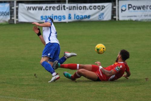 Mersthams Harry Osborne (R) challenges Brandon Adams
