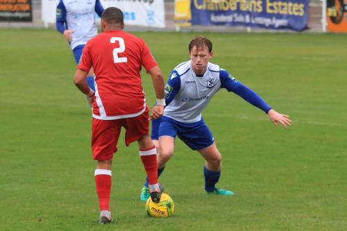 Mersthams Michael Abnett (L) and Enfields Aaron Greene