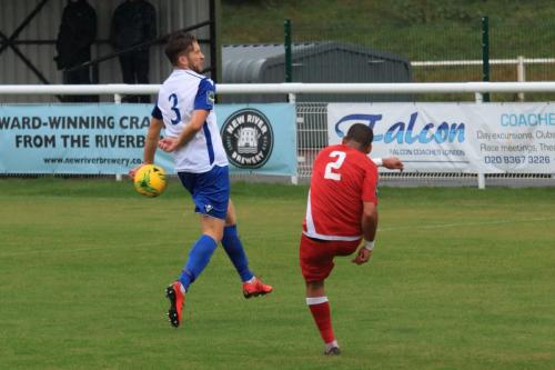 Mersthams Michael Abnett (R) and Enfields Remi Sutton