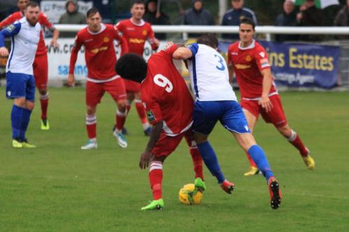 Mersthams Walter Figueira (9) tackles Remi Sutton