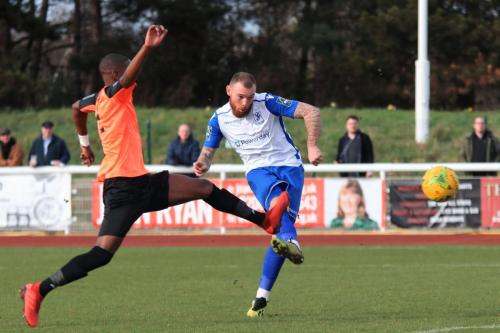 After Sam Youngs shot had hit the crossbar, Enfields Billy Bricknell shoots from the rebound but is denied by the keeper