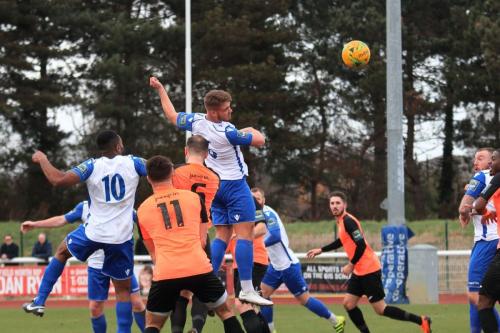 Dan Rumens (white no 6) becomes the second Enfield player to hit the crossbar