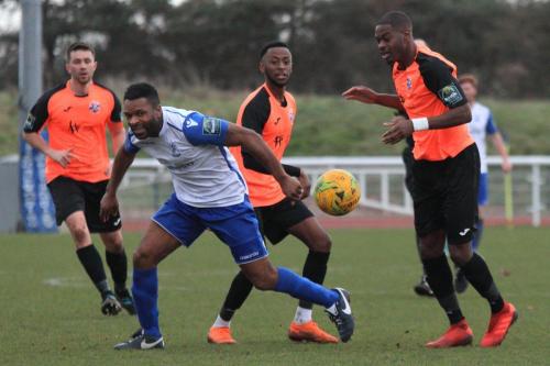 Enfields Kezie Ibe and Tonbridges Tom Parkinson (L), DSean Theobalds and James Folkes (R)