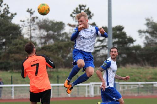 Enfields Ryan Blackman heads the ball over Adem Ramadan