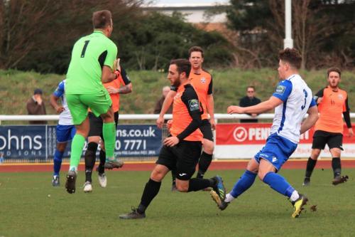 Tonbridge keeper Jonathan Henly collects a cross