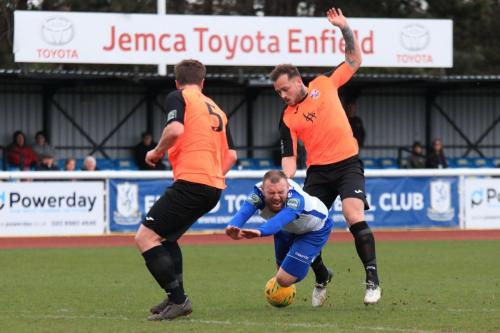 Tonbridges Arthur Lee (R) earns a yellow card for a trip on Billy Bricknell