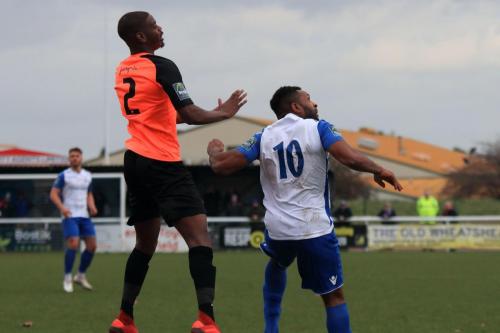 Tonbridges James Folkes (L) and Enfields Kezie Ibe