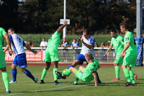 Dorkings Chris Boulter (on floor) challenges Sam Youngsx
