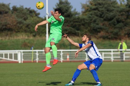Dorkings Matthew Briggs (L) and Enfields Remi Sutton