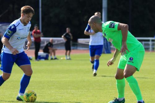 Enfields Lewis Taaffe (L) runs at Sami El-Abd