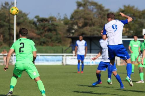Enfields Liam Hope (9) heads across the penalty box