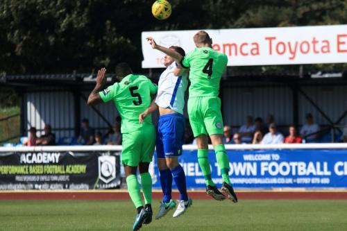 Enfields Liam Hope challenged by Jerome Beckles (5) and Chris Boulter