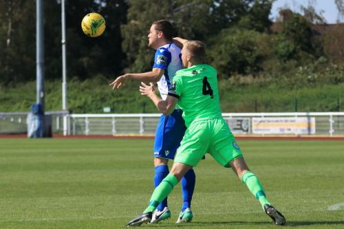 Enfields Liam Hope controls the ball under pressure from Chris Boulter