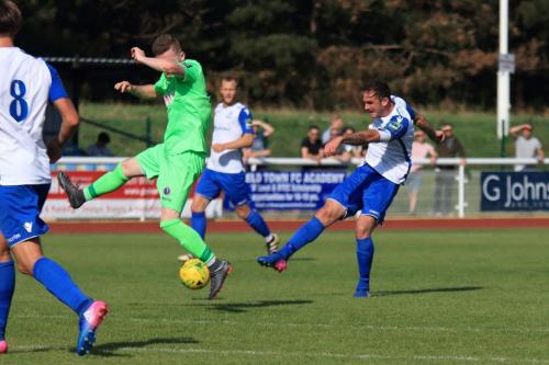 Enfields Matt Johnson shoots as Chris Boulter tries to block