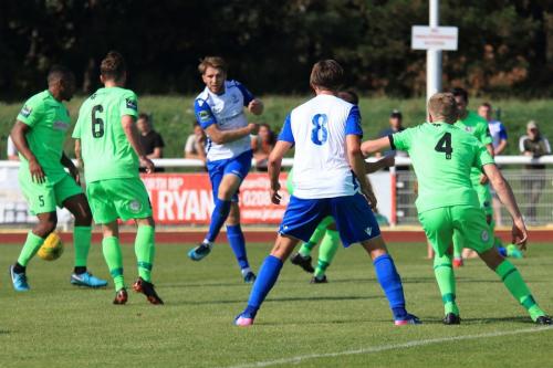 Enfields Remi Sutton (white, L) shoots