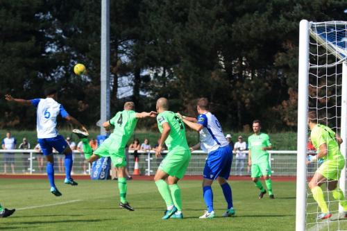 Enfields Rian McLean (6) challenges at a corner
