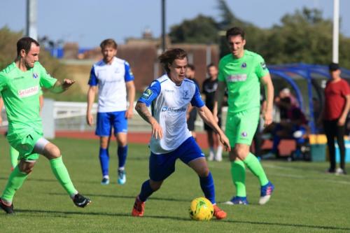 Enfields Sam Chaney runs past Luke Moore (L) and Jason Prior