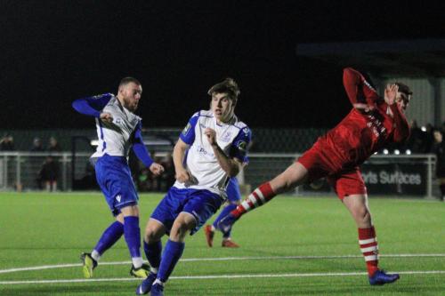 Billy Bricknell (L) shoots
