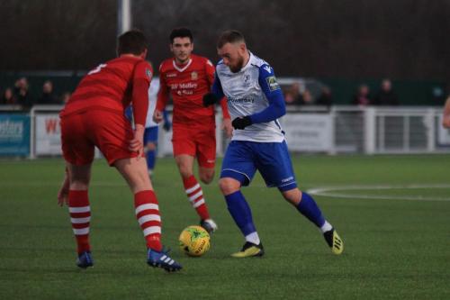 Enfields Billy Bricknell (R) cuts inside past Glenn Wilson