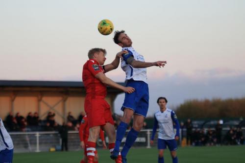 Enfields Matt Johnson (R) wins a header against Alex Bentley