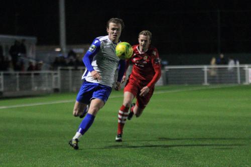 Enfields Mickey Parcell (L) beats Ronnie Winn before crossing to set up the opening goal