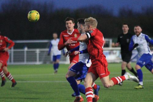 Enfields Sam Chaney (white) challenged by Alex Bentley