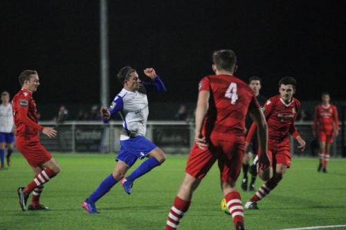 Enfields Sam Youngs (white) runs at the defence