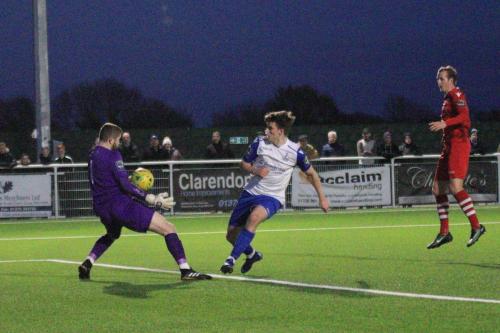 Hornchurch keeper Callum Chafer saves from Josh Davison