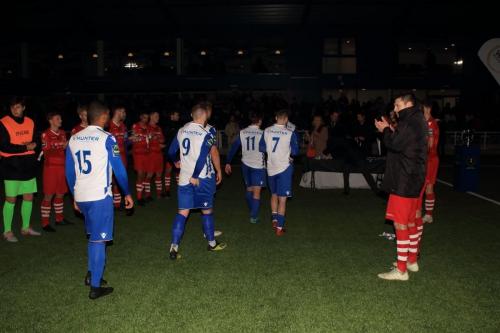 Hornchurch players form a guard of honour as Enfield collect their medals