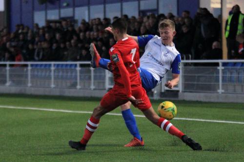 Hornchurchs George Saunders (L) blocks a cross from Joe Payne