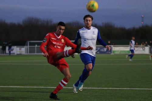 Hornchurchs George Saunders (L) clears from Lewis Taaffe