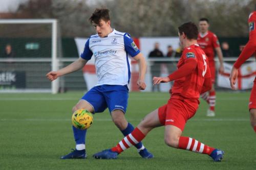 Hornchurchs Glenn Wilson (red) challenges Josh Davison