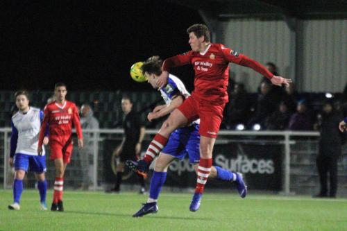 Hornchurchs Glenn Wilson (red) challenges Josh Davisonx