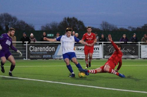 Hornchurchs Glenn Wilson (red) puts enough pressure on Jposh Davison to prevent him getting a clear shot