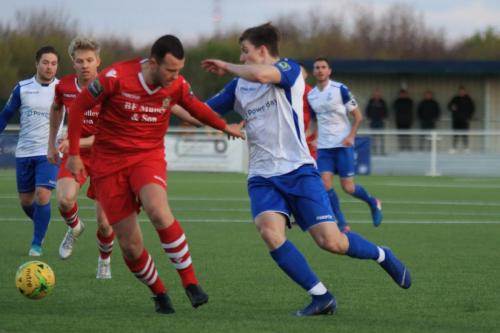 Hornchurchs Jordan Clark (red) and Enfields Josh Davison