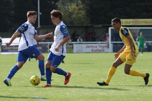 Enfields Lewis Taaffe (L) and Sam Chaney and Hornchurchs George Saunders