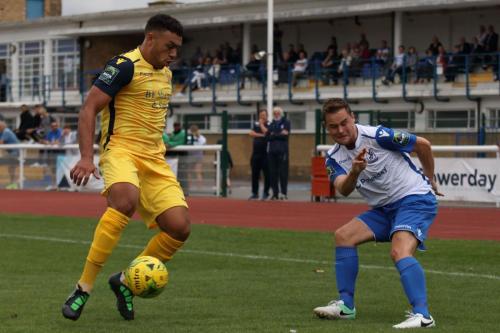 Enfields Liam Hope (R) gets a cross in despite the attention of Nathan Cooper