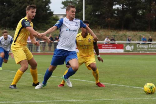 Enfields Liam Hope and Hornchurchs Kenzer Lee (L) and Nathan Livings