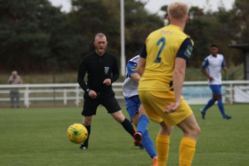 Enfields Sam Chaney hits a shot against the bar in the first minute
