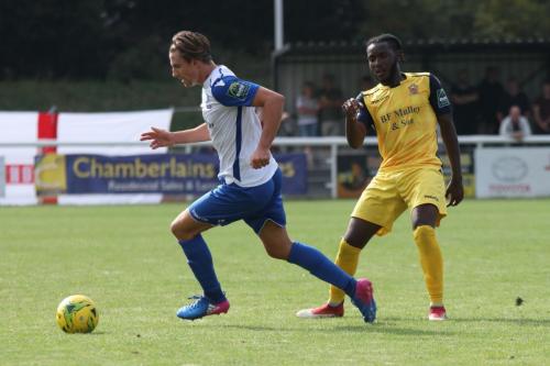 Enfields Sam Youngs (L) and Hornchurchs Tobi Coker