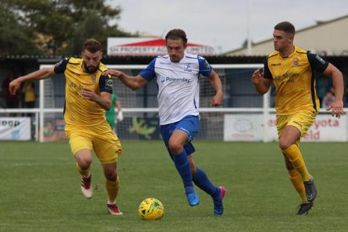Enfields Sam Youngs and Hornchurchs Brad Warner (L) and Conor Hogan