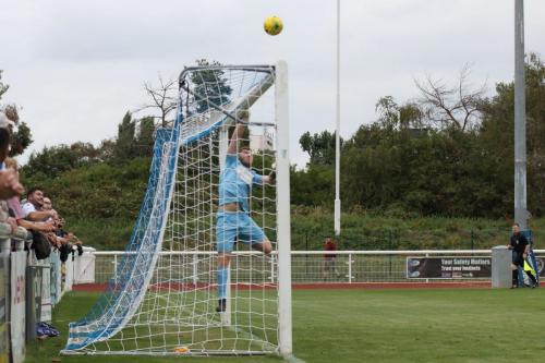 Hornchurch keeper Calum Chafer has to back-pedal to cover a long-range effort from Remi Sutton