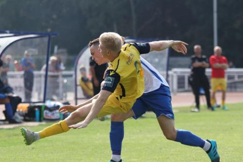 Hornchurchs Alex Bentley (yellow) and Enfields Brandon Adams